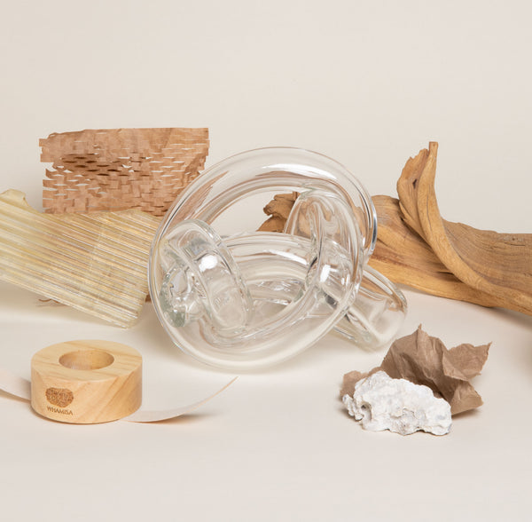 Assortment of random objects including wood, glass pipes, and leaves.